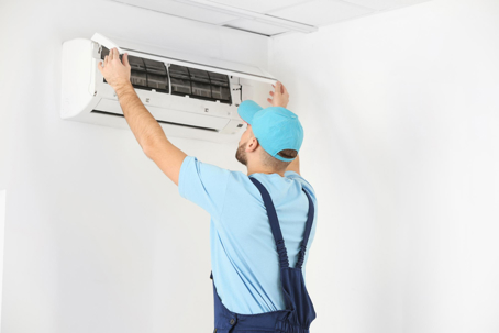 tech fixes HVAC