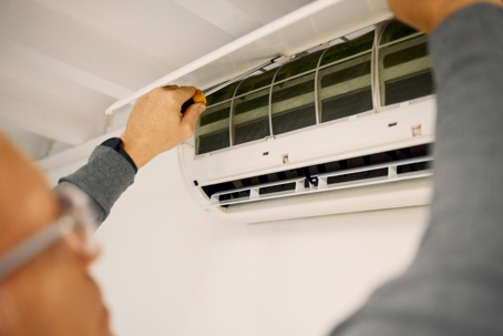 tech fixes HVAC