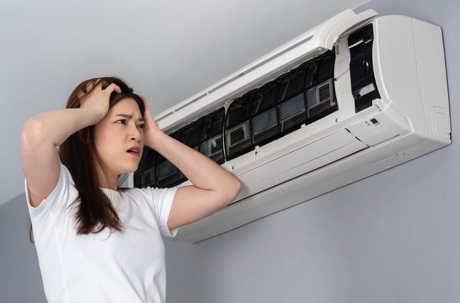 Frustrated woman on the ac