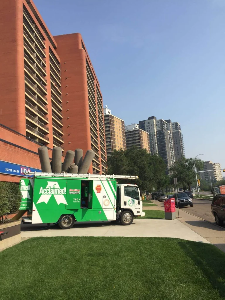 Acclaimed truck in front of a condo building